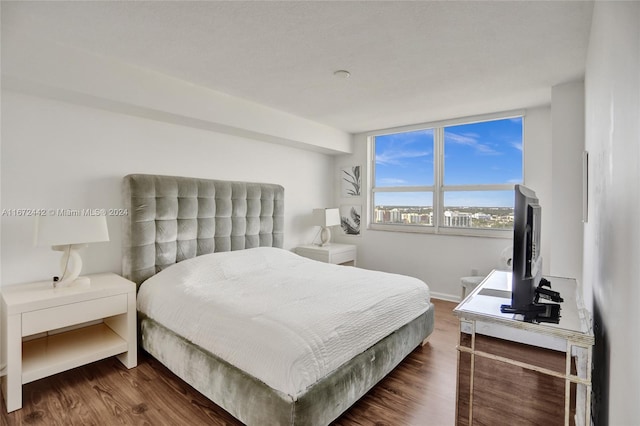 bedroom featuring dark wood-type flooring