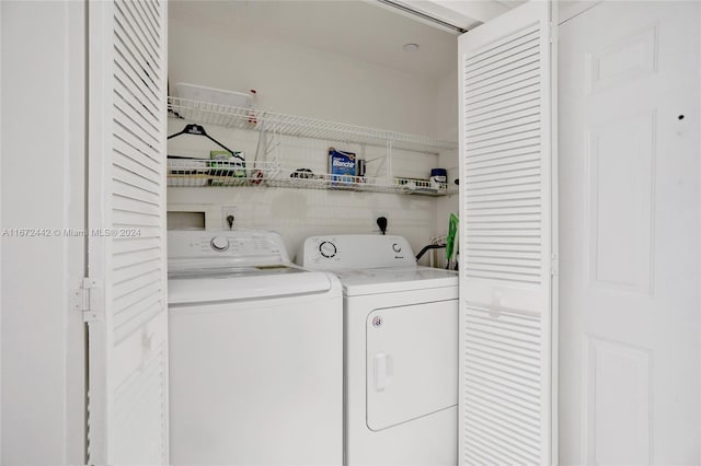 washroom with washing machine and dryer