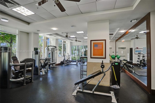 workout area with a paneled ceiling