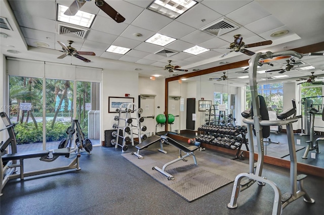 exercise room with a paneled ceiling