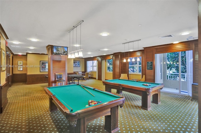 playroom featuring a wealth of natural light, wood walls, and pool table