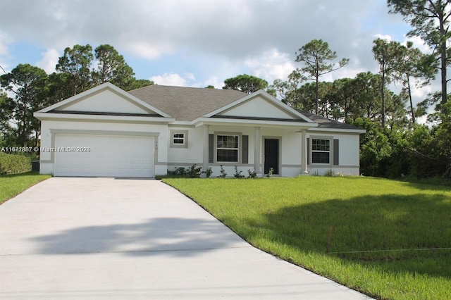 ranch-style house featuring a front yard and a garage