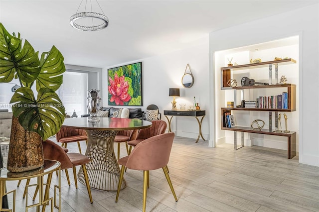 dining area with light hardwood / wood-style flooring