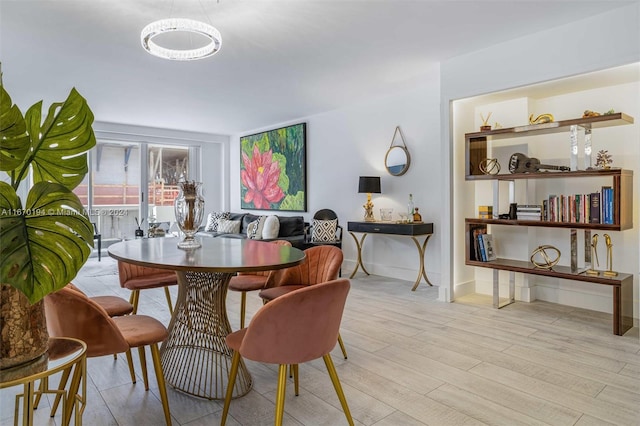 dining area with light hardwood / wood-style floors