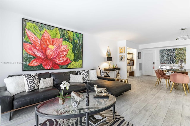 living room with light hardwood / wood-style flooring