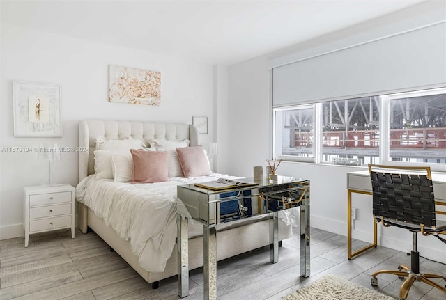 bedroom with light hardwood / wood-style flooring