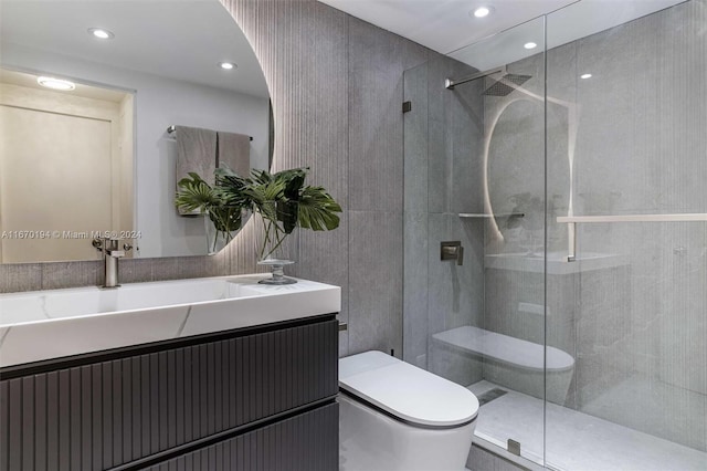 bathroom featuring walk in shower, vanity, and toilet