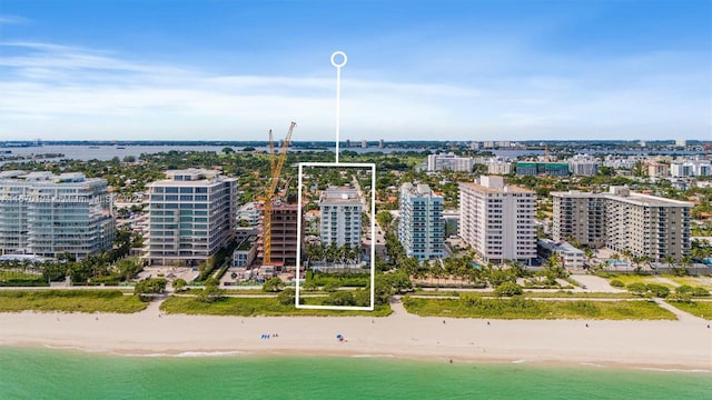 bird's eye view with a view of the beach and a water view