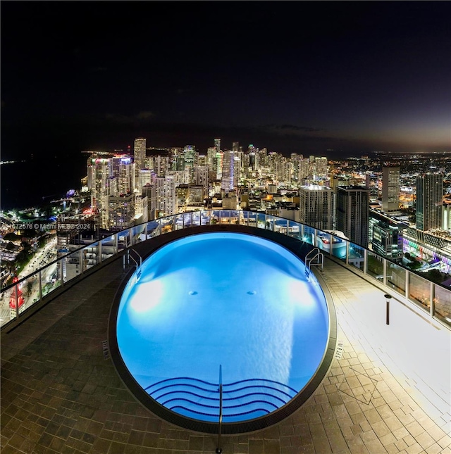 view of pool at night