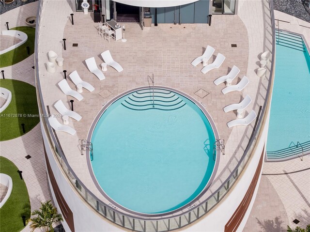 view of pool featuring a patio area