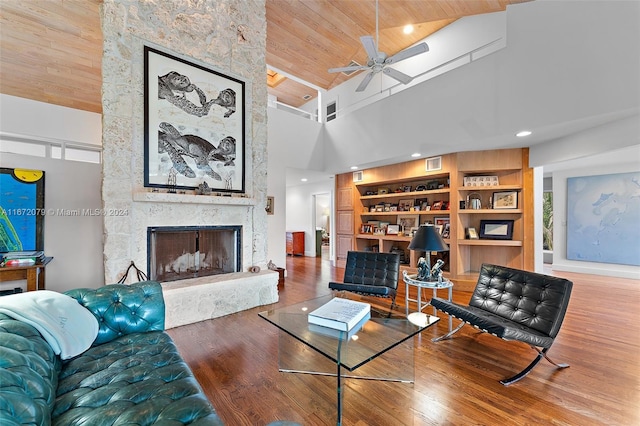 living room with high vaulted ceiling, wooden ceiling, a large fireplace, ceiling fan, and hardwood / wood-style floors