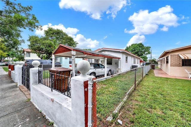 view of front of property with a carport and a front yard