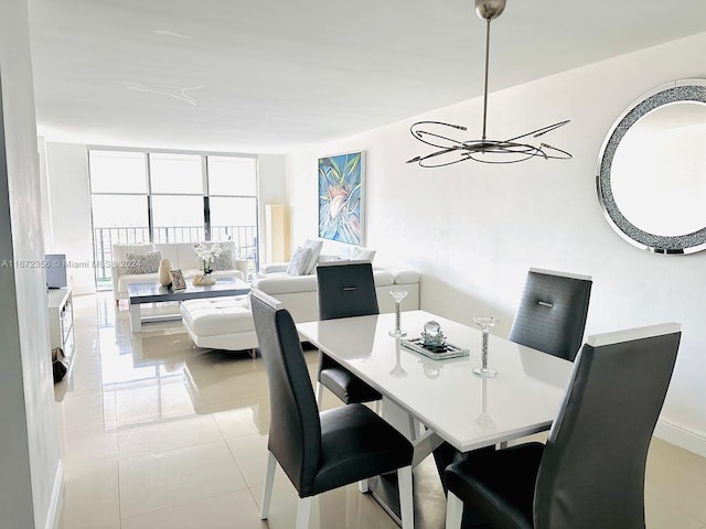 dining space with light tile patterned floors