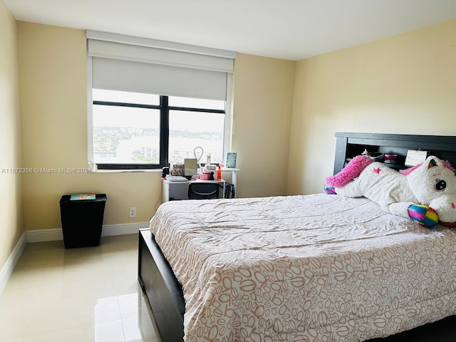 bedroom with light tile patterned floors