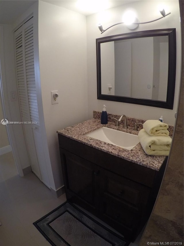 bathroom featuring vanity and tile patterned flooring