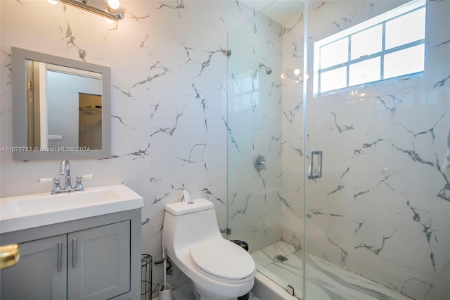 bathroom featuring vanity, toilet, and an enclosed shower