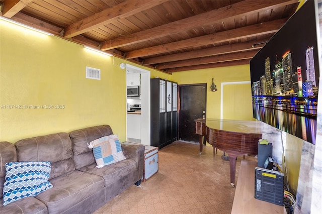 living room with beam ceiling, tile patterned floors, visible vents, and wooden ceiling