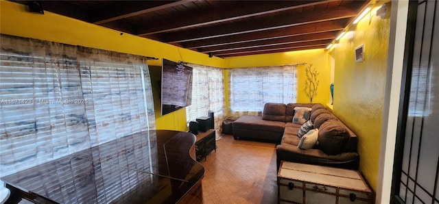 living room featuring beam ceiling