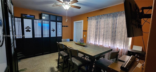 dining space featuring ceiling fan