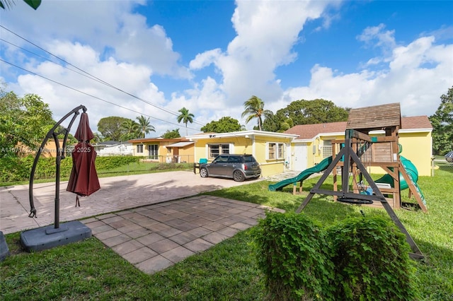 view of playground with a yard