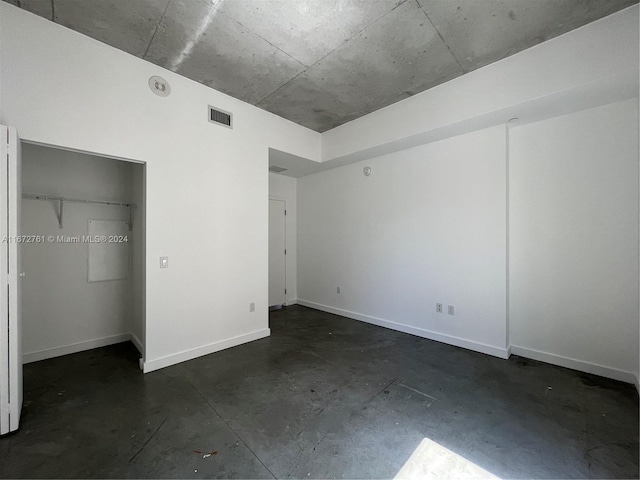 unfurnished bedroom with a closet