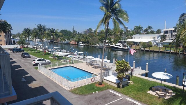 view of pool featuring a water view