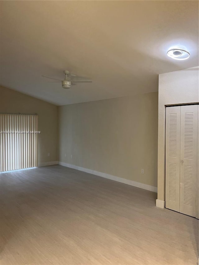 spare room featuring light wood-type flooring and ceiling fan