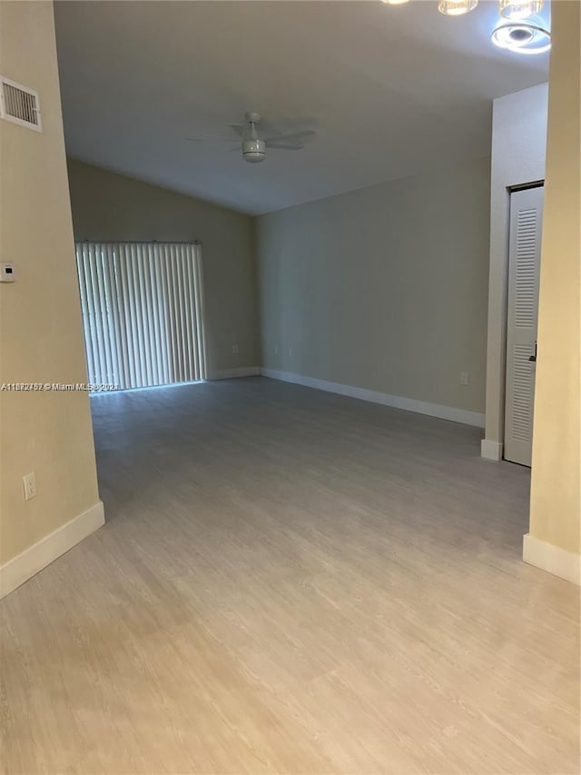 spare room featuring ceiling fan and light hardwood / wood-style floors