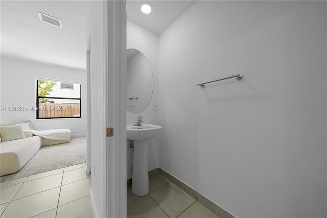 bathroom featuring tile patterned flooring and sink