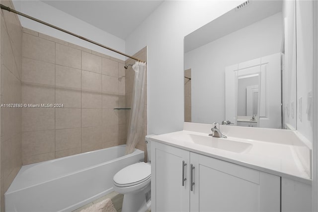 full bathroom featuring vanity, toilet, and shower / bathtub combination with curtain