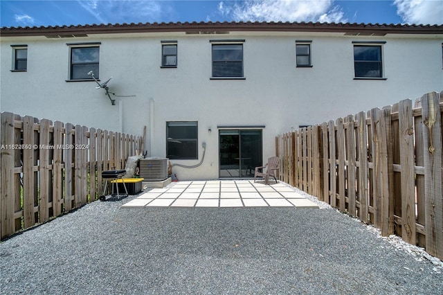 back of property featuring a patio area and central air condition unit