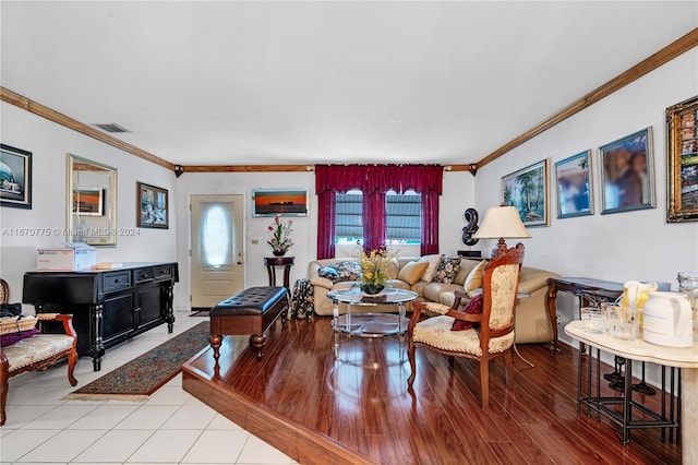 living room featuring light wood-type flooring and crown molding