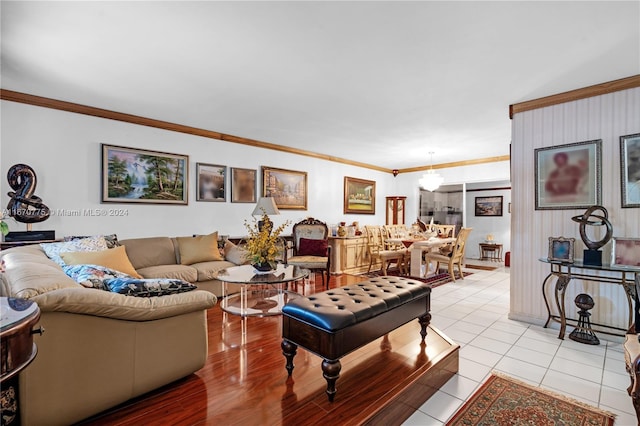 living room featuring light hardwood / wood-style floors and crown molding