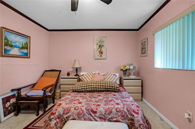 bedroom with ceiling fan, crown molding, and light colored carpet