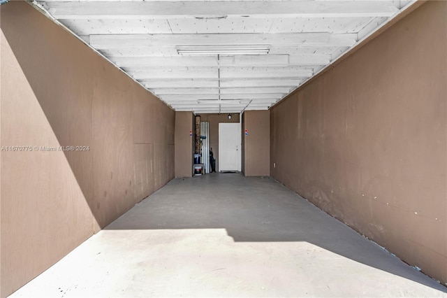 hallway featuring concrete flooring