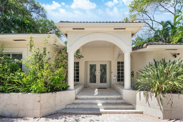 doorway to property featuring french doors