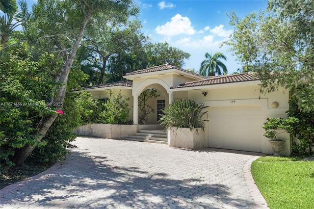 mediterranean / spanish house featuring a garage