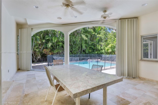 view of pool featuring ceiling fan