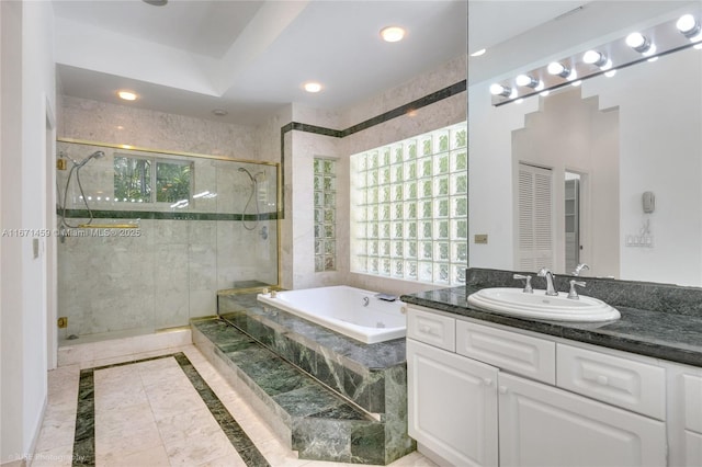 bathroom featuring vanity and plus walk in shower