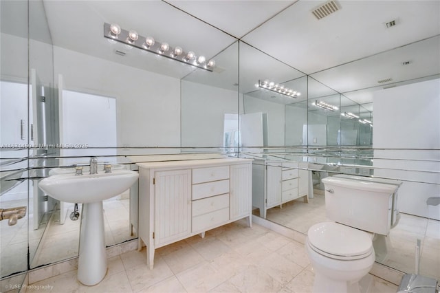 bathroom featuring sink and toilet