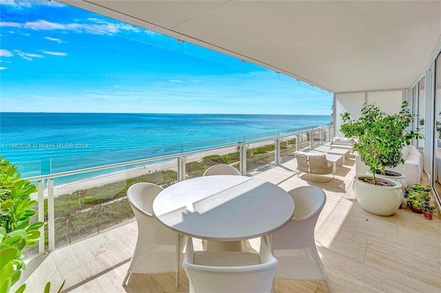 balcony with a view of the beach and a water view