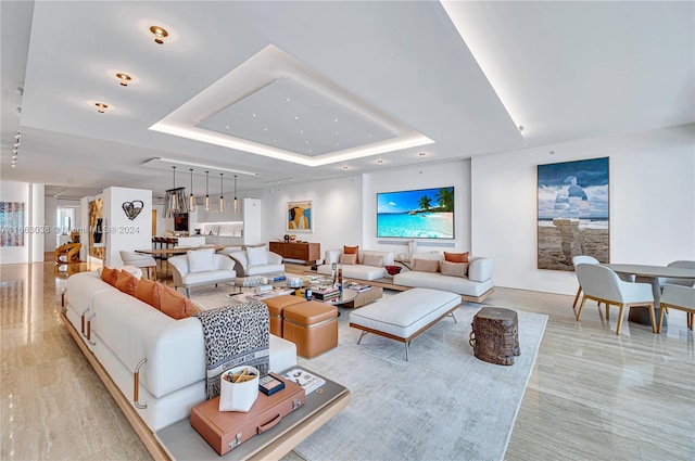 living room featuring a raised ceiling