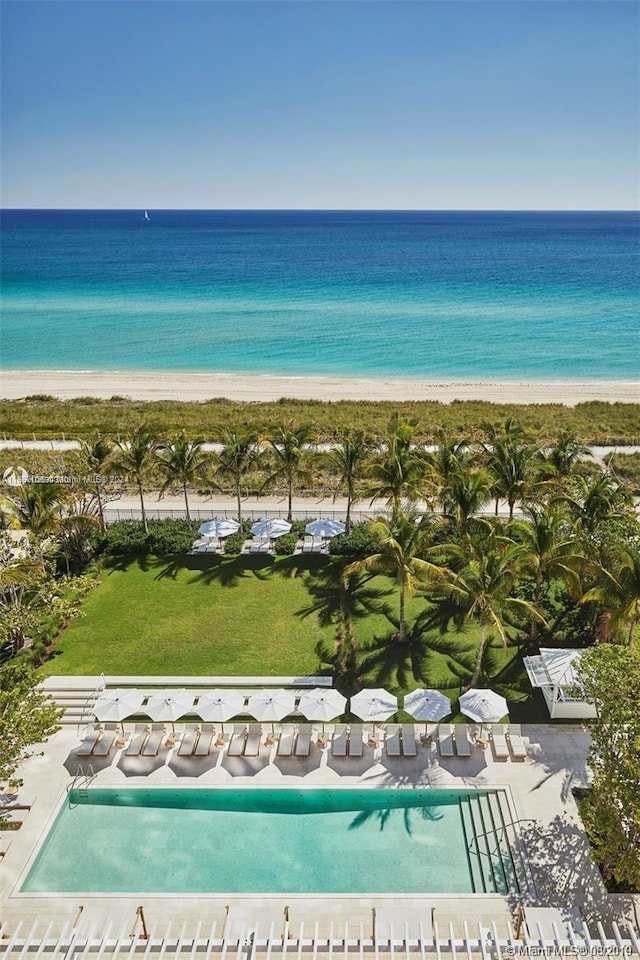 birds eye view of property with a water view