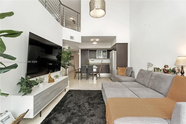 living room featuring a high ceiling