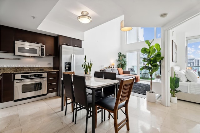 dining space with light tile patterned floors