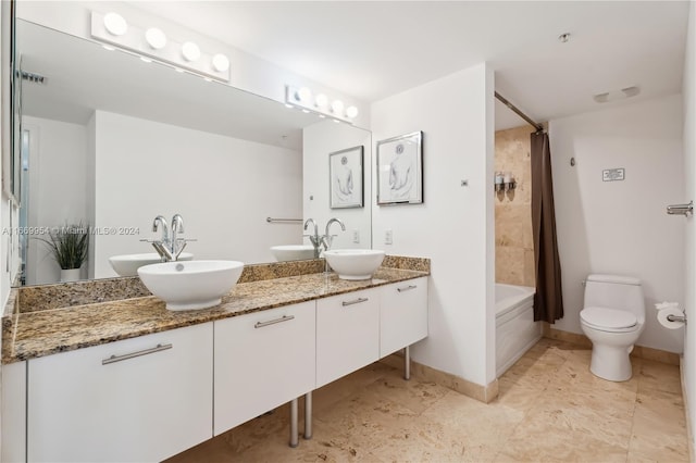 full bathroom featuring vanity, toilet, and shower / bath combo with shower curtain