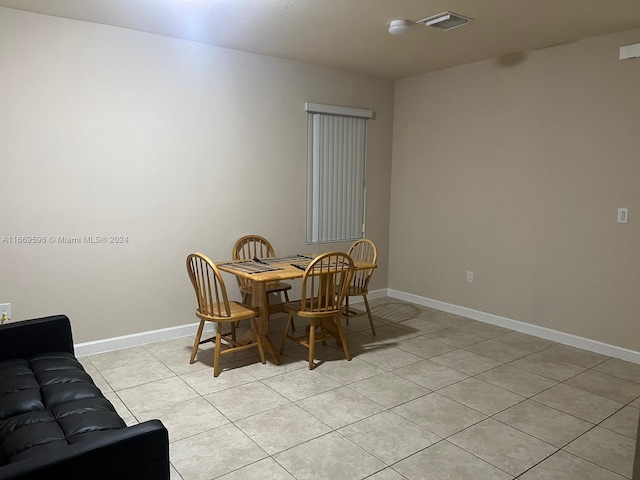 dining space with light tile patterned flooring