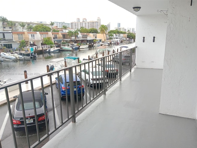 balcony featuring a water view