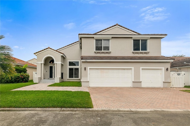 view of front facade featuring a garage and a front lawn