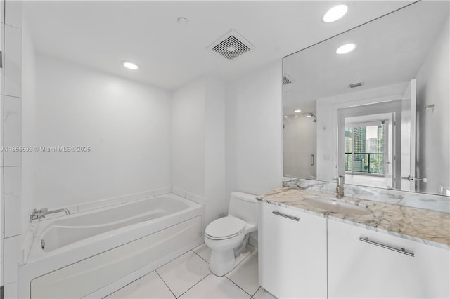 bathroom featuring a garden tub, a shower with door, visible vents, toilet, and vanity